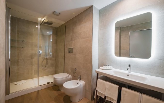 Badkamer van een tweepersoonskamer van Resort Spa Cala Ponte in Puglia