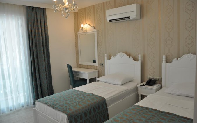 Slaapkamer van Hotel Kleopatra Atlas in Alanya